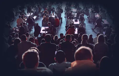 Public Events & Forums - Exploring AI Together A gathering of people discussing AI topics at a public event or forum.